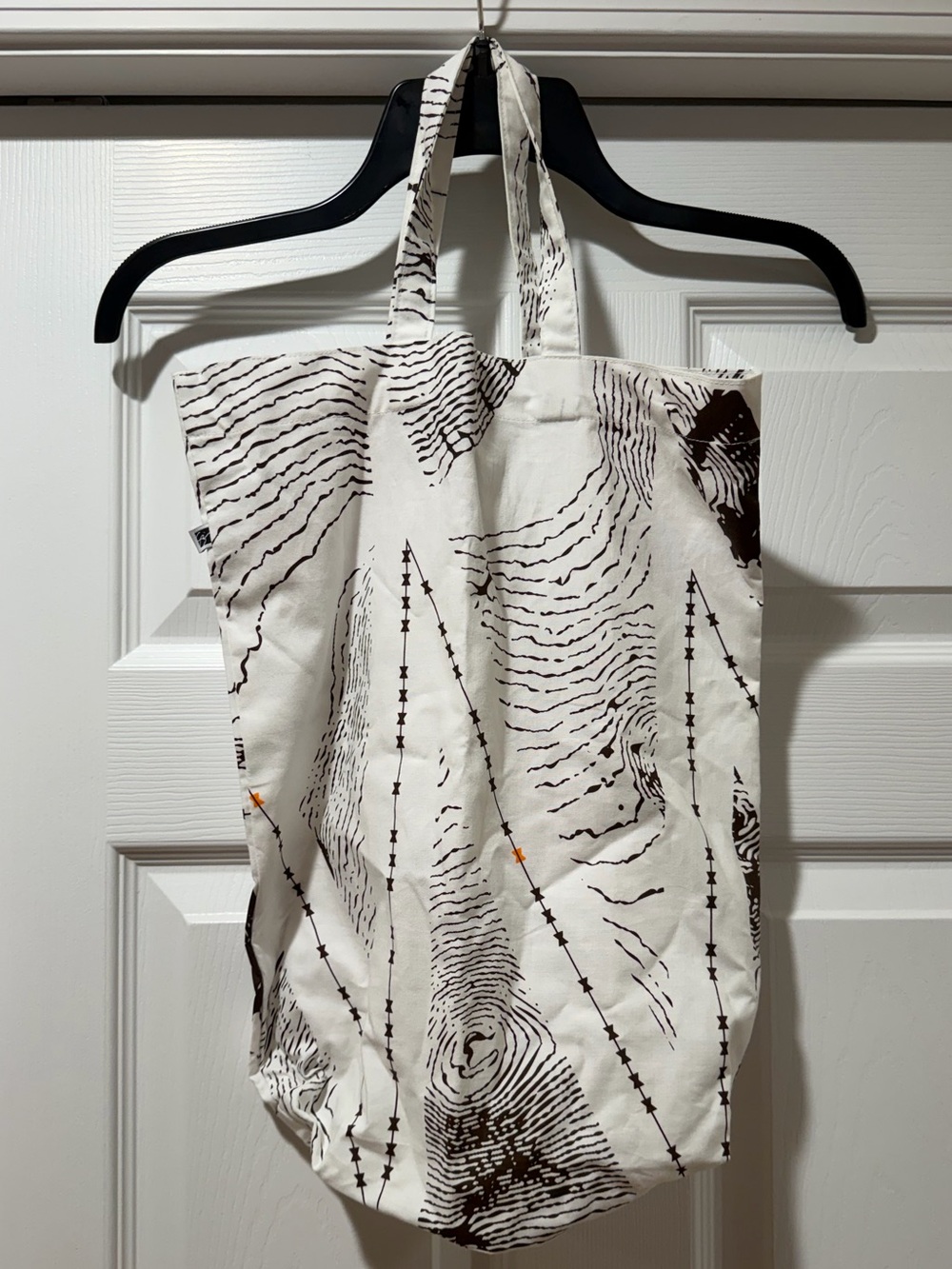 Sig Zane: brown and white patterned print tote.
